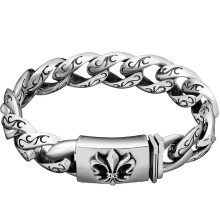 Pulseira masculina vintage de aço com corrente curb e tatuagem tribal.