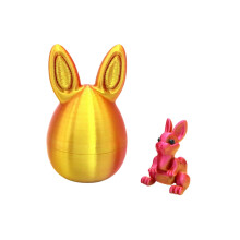 Adorno de huevo de Pascua impreso en 3D con figura de conejito dorado