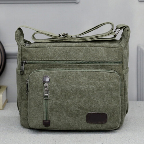 Men's green canvas shoulder bag with multiple pockets