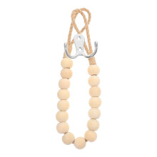 Anneau porte-serviettes mural en bois beige et fer, avec corde en jute, pour salle de bain et cuisine.