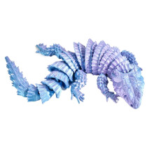 Figura de lagarto impressa em 3D com articulações móveis e que pode ser aberta.