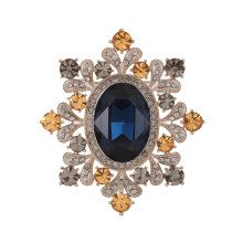 Broche ovalado vintage con cristal azul y circonita.