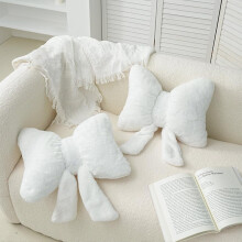 Set di 2 cuscini decorativi in peluche a forma di fiocco