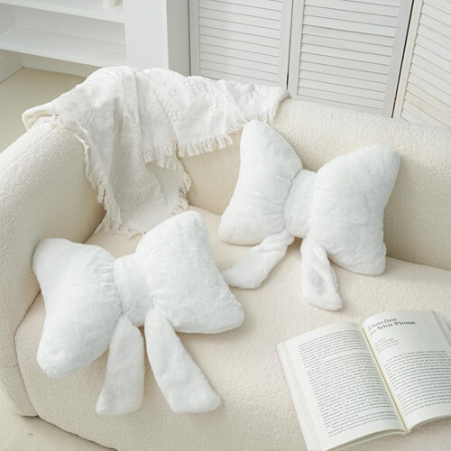 Set di 2 cuscini decorativi in peluche a forma di fiocco