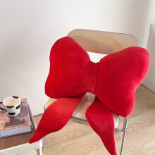 Cojín decorativo con forma de lazo en color rojo, 70x40cm, 1 unidad.