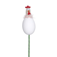 Påskbordsarrangemang med kyckling och ägg och blomsterdekor