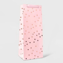 Sacola de presente para garrafa de vinho de Natal com estrelas metalizadas douradas, vermelhas e rosa.