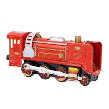 Giocattolo vintage in ferro a forma di locomotiva rossa da trenino a molla per decorazioni di caffè e bar