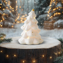 Keramisch kerstdorpje in de vorm van een huisje met lichtwit porselein.