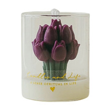 Vela aromática con forma de tulipán en frasco de vidrio.