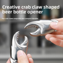 Abrebotellas de acero inoxidable con forma de cangrejo: compacto y ergonómico.