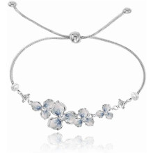 Armband met blauwe bloemen in kleurverloop, verstelbaar, van koperlegering.