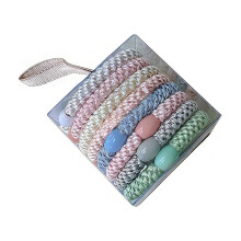 Gomas para el cabello y coleteros multicolores de tela trenzada (8 unidades)