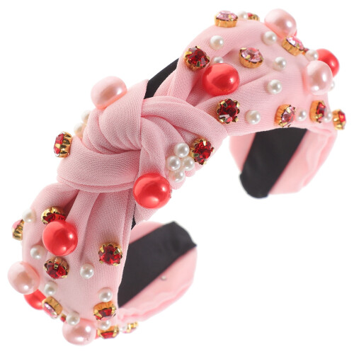 Fascia per capelli da donna con strass rosa e nodo.