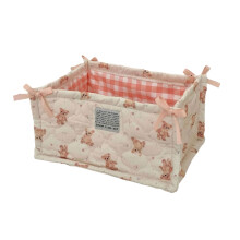 Panier de rangement de bureau élégant en tissu matelassé, pratique pour ranger soigneusement les petits objets et accessoires.