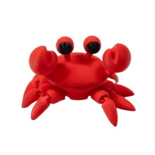 Portachiavi a forma di micro granchio stampato in 3D con articolazioni mobili.