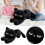 Coussin de canapé doux et moelleux en forme de chat noir couché 1