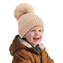 Bonnet d'hiver tricoté pour enfant AWZXDE avec pompon, beige, idéal par temps froid.