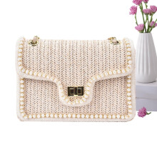 Bolso de hombro de paja para mujer con perlas de imitación y cierre de cremallera.