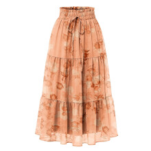 Maxi-rok van chiffon voor dames met bloemenprint, ruches en strik, uitlopend in oranje.