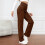 Calça jeans feminina de cintura alta e perna reta, com tecido elástico. 4