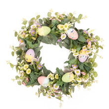 Perfect cadeau: paaseierenkrans, kleurrijke paaseieren versierd met weelderige groene bladeren voor binnen- en buitendecoratie in de lente, duurzaam