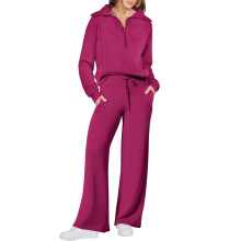 Ensemble de survêtement deux pièces automne-hiver pour femme : sweat-shirt à demi-zip et pantalon large à poches, idéal au quotidien.