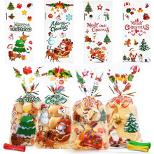 100 sacchetti trasparenti in cellophane per dolcetti natalizi con motivo di Babbo Natale, campanelle e alci – Compatibili con gli accessori per
