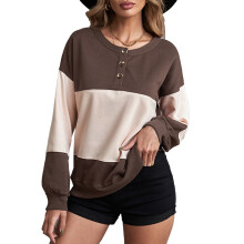 Sudadera informal de manga larga con bloques de color, cuello redondo, tejido elástico, material suave y transpirable, corte relajado.