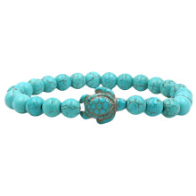 Handgemaakte armband met een afbeelding van een Hawaïaanse zeeschildpad en echte turkooizen steen, helende lavasteen en een handgemaakte armband met