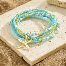 Modieuze meerlaagse enkelband met rijstkralen en zeesterhanger voor dames, boho-stijl, kleurrijke sieraden, zomerse strand- en enkelketting, ideaal
