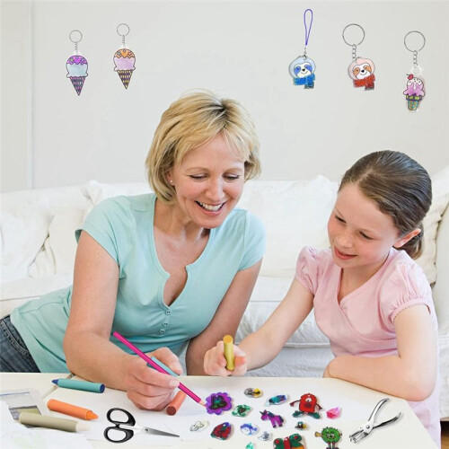 165 PCS Shrink Plastic Kit - 15 Shrink Plastic Films, 5 Patterned Sheets, 12 Colored Pencils, 130 Keychain Accessories 1