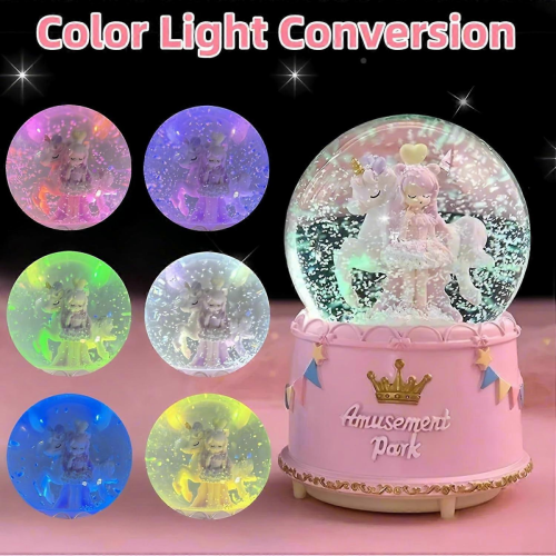 Carillon con unicorno rosa e neve artificiale, luci LED e effetto neve automatica. 1