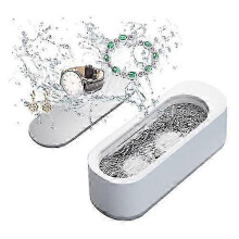 Pulitore a ultrasuoni portatile a 360 per gioielli, occhiali, orologi e protesi dentarie, realizzato in plastica ABS bianca.