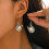 (4474) Bohemian U-Shaped Alloy Earrings with Pine Stone 2