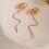Boucles d'oreilles robustes avec pompons fluides et zircons 5