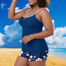 Conjunto de biquíni tankini plus size feminino com estampa tropical de folhas, com bojo embutido, ideal para praia e piscina.