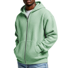 Moletom masculino com capuz, zíper frontal e textura waffle, com bolso canguru.