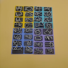 Rompecabezas de 8 piezas con anillos entrelazados de metal para fortalecer la concentración y el razonamiento lógico.