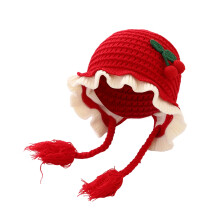 Cappellino invernale da bambina con fiocco e paraorecchie in maglia, morbido, caldo e antivento.