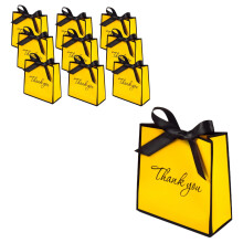 Lot de 10 mini sacs cadeaux jaunes avec nœud imprimé, en papier, pour ranger petits cadeaux et amuse-gueules lors de fêtes. Dimensions : 14 x 14 x