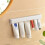 Wall Mount Bathroom Toothpaste Holder Multifunctional Space-Saving Toothpaste Holder No Drilling Required Storage Rack 7