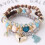 Wassertropfenförmiges Herzquastenarmband für Damen - Perlen 1