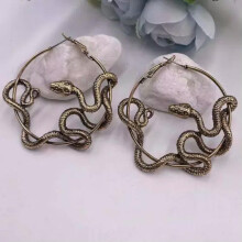 Boho damesoorbellen met vergulde slangen- en maanmotief