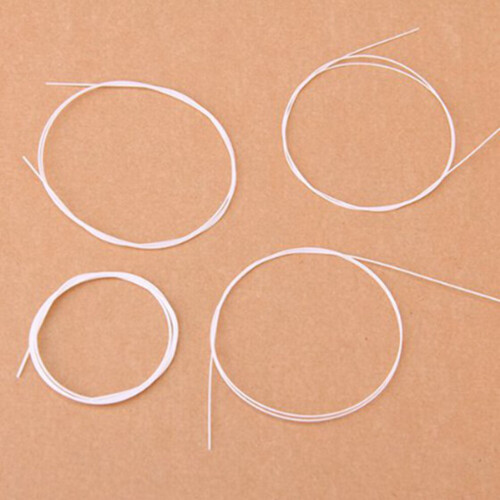 12 piece white nylon ukulele string set 1