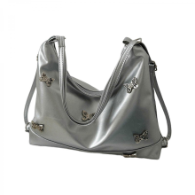 Stylish PU underarm tote bag with a unique design, perfect for fashionable women who appreciate detail and quality. Available in brown and silver.