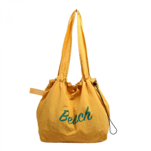 Sweet candy-colored canvas shoulder bag with letter print, stylish large-capacity drawstring tote bag, unisex, yellow.