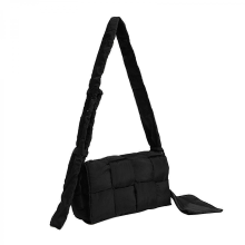 Black woven cotton crossbody bag, padded, designer style.