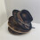 Elegant Distressed Bucket Cap With Feather Accent Soft-camel1 2