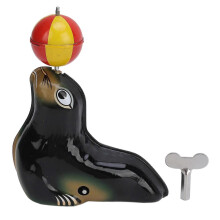 Figurina d'otarie in equilibrio su una boule, gioco meccanico vintage per bambini e tutti i piccoli,